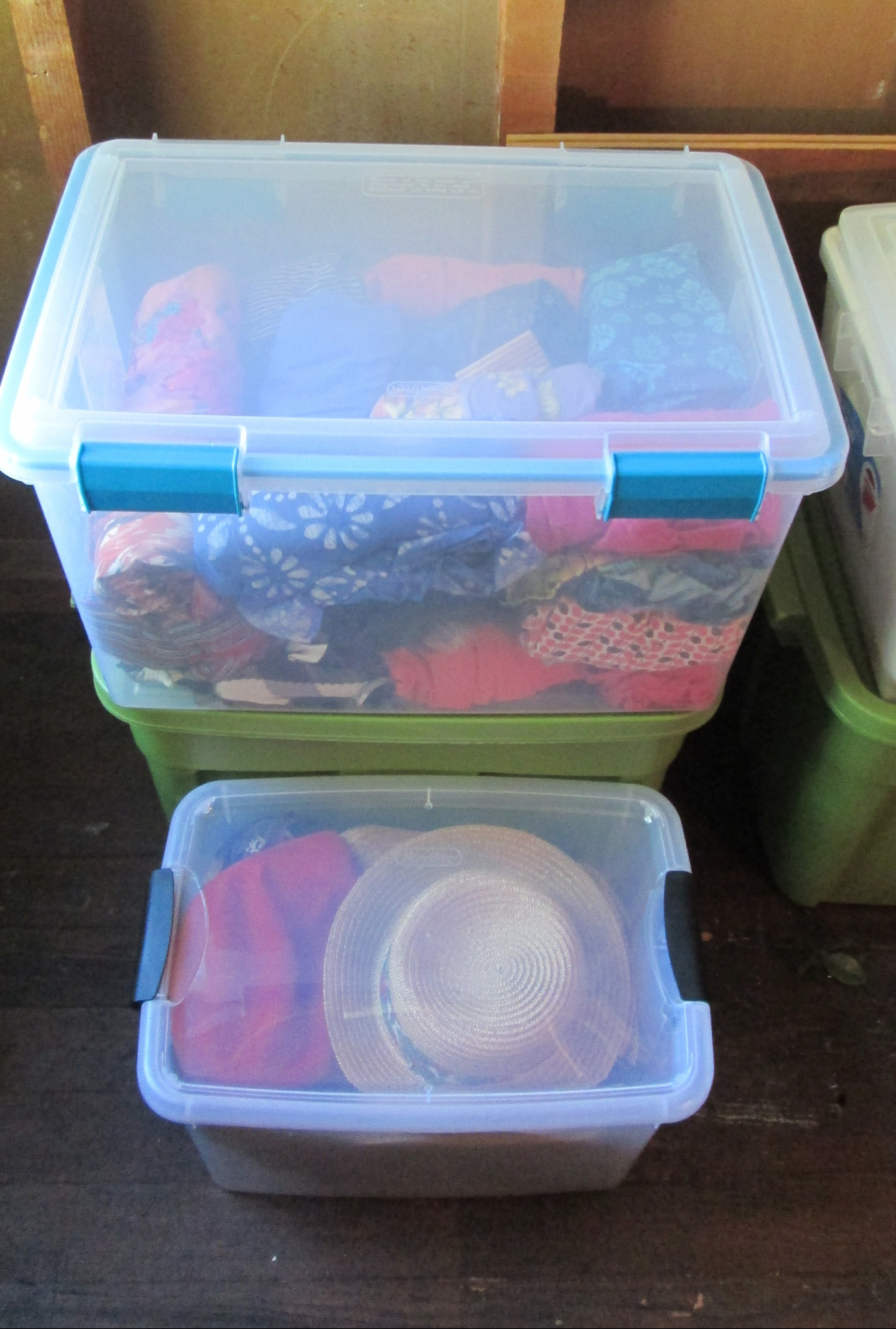 Use covered plastic containers to store clothing